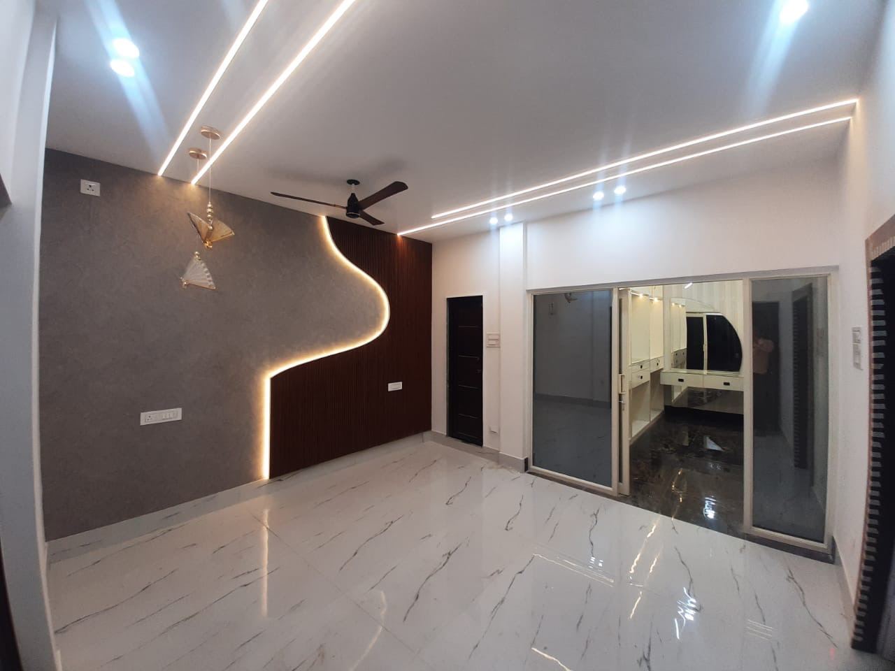 Living room with lit feature wall